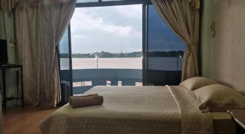 Bed in Just Mansion Hotel