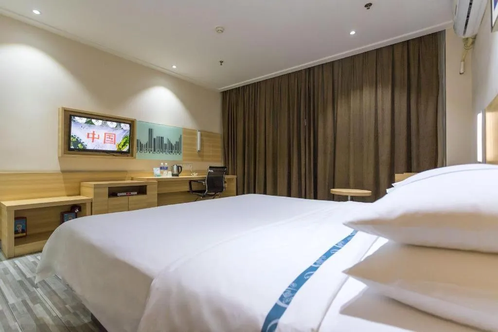 Bed in City Comfort Inn Huanggang Guibinlou Wanda Square