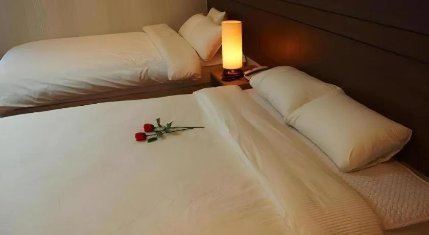 Bed in CJ Tourist Hotel