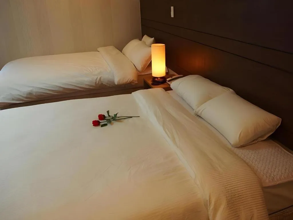 Bed in CJ Tourist Hotel