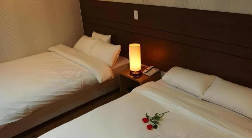 Bed in CJ Tourist Hotel
