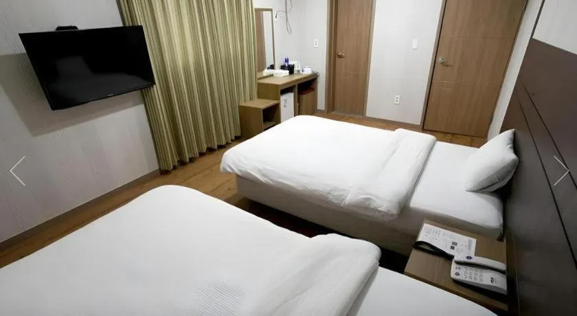 Bed in CJ Tourist Hotel