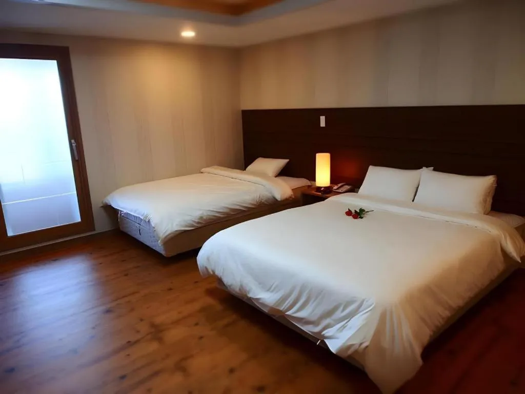 Bed in CJ Tourist Hotel