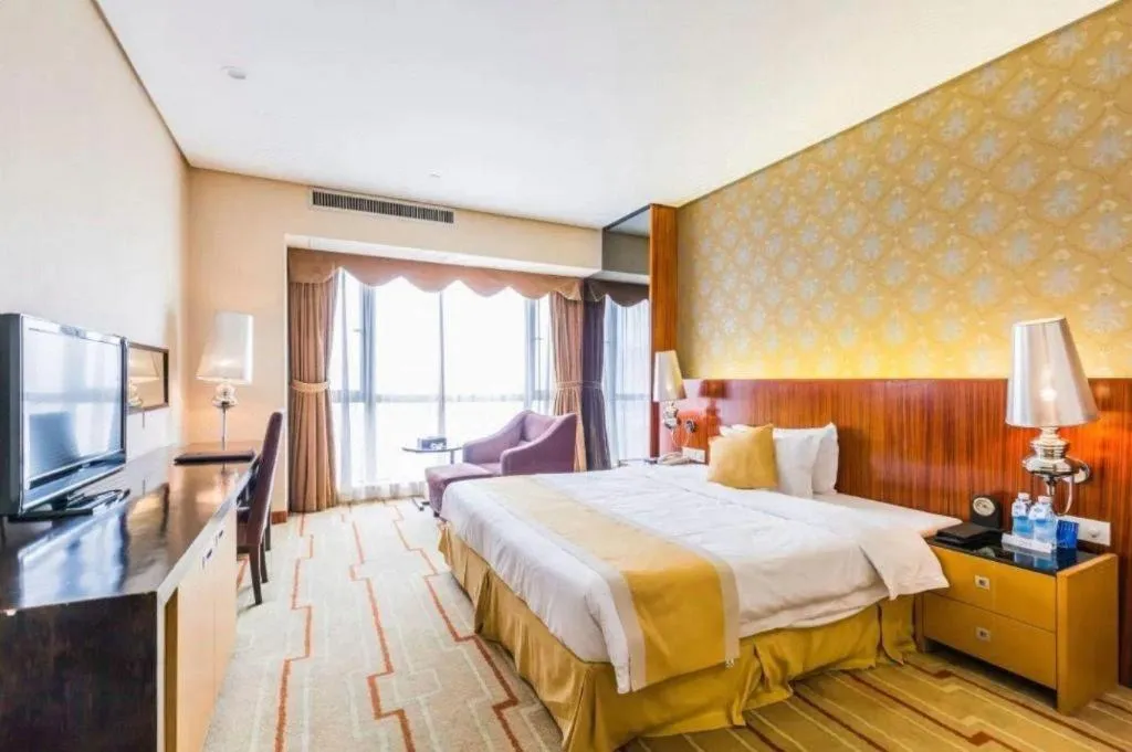 Bed in Foshan Nanhai Huifeng Holiday Hotel