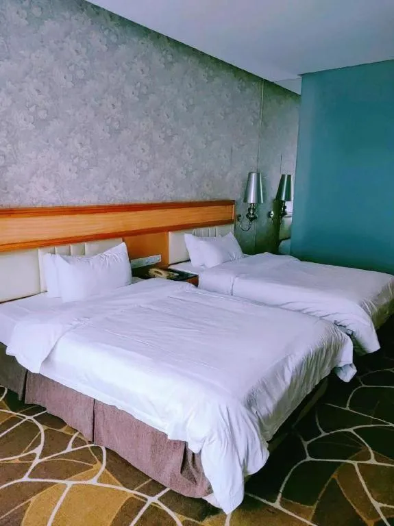 Bed in Foshan Nanhai Huifeng Holiday Hotel