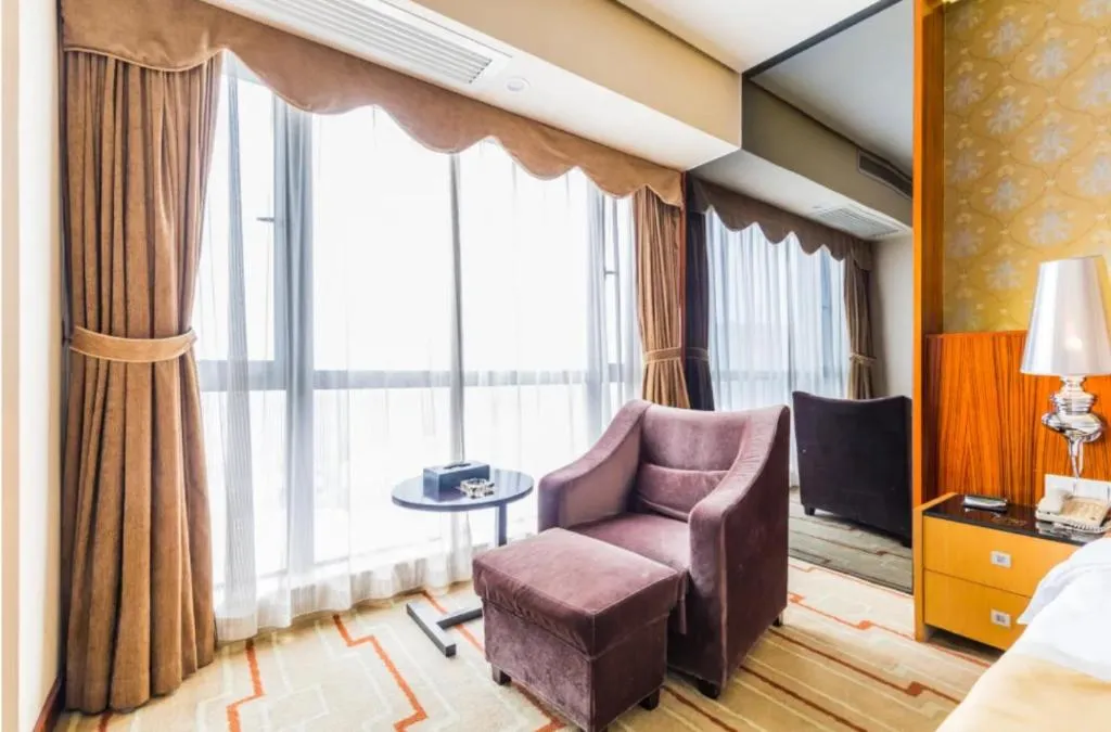 Bed in Foshan Nanhai Huifeng Holiday Hotel