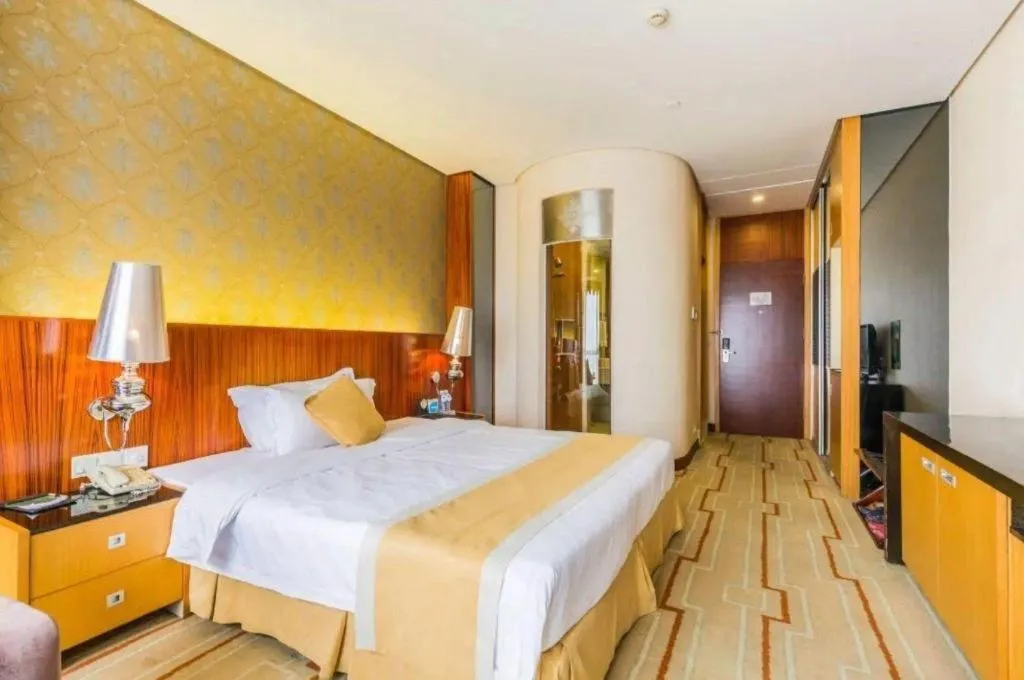 Bed in Foshan Nanhai Huifeng Holiday Hotel