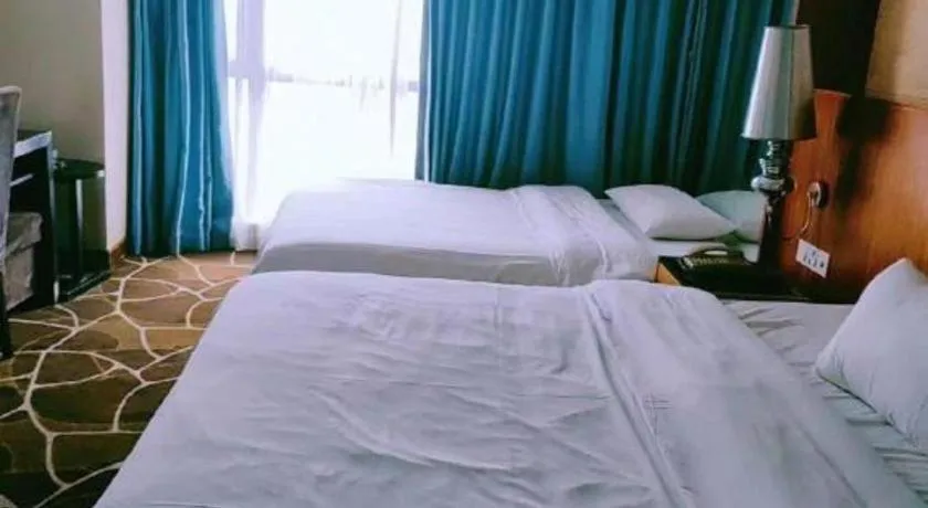 Bed in Foshan Nanhai Huifeng Holiday Hotel