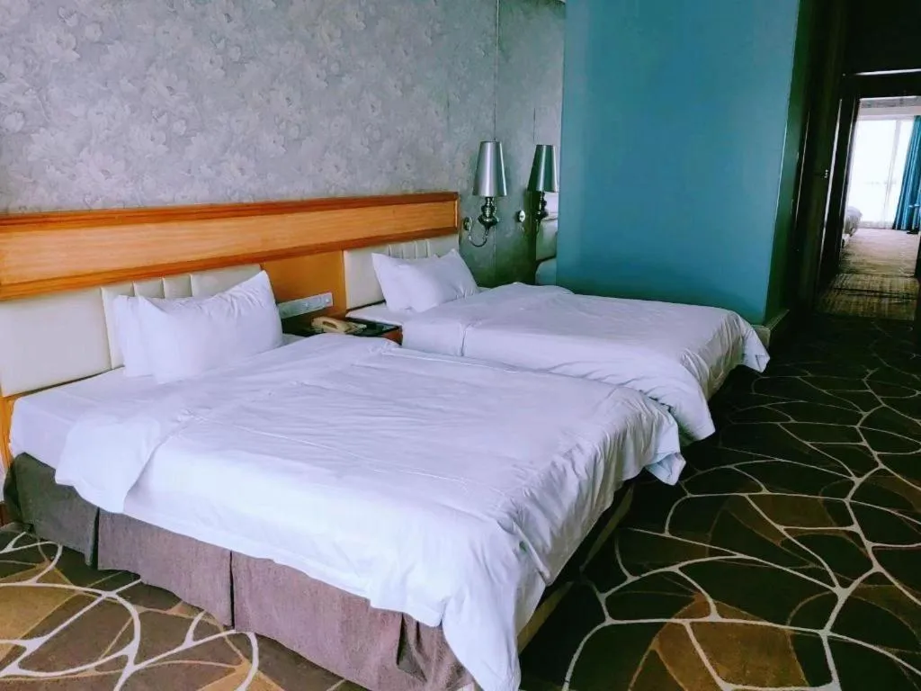 Bed in Foshan Nanhai Huifeng Holiday Hotel