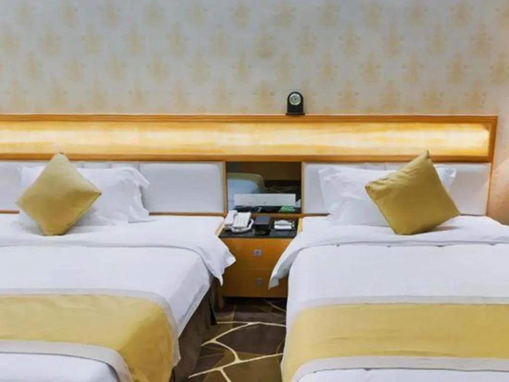 Bed in Foshan Nanhai Huifeng Holiday Hotel