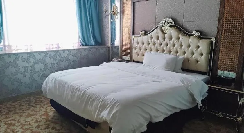 Bed in Foshan Nanhai Huifeng Holiday Hotel