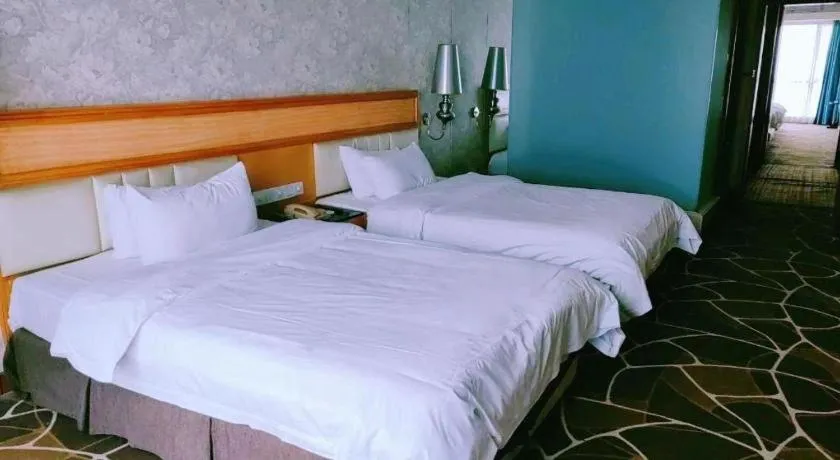 Bed in Foshan Nanhai Huifeng Holiday Hotel