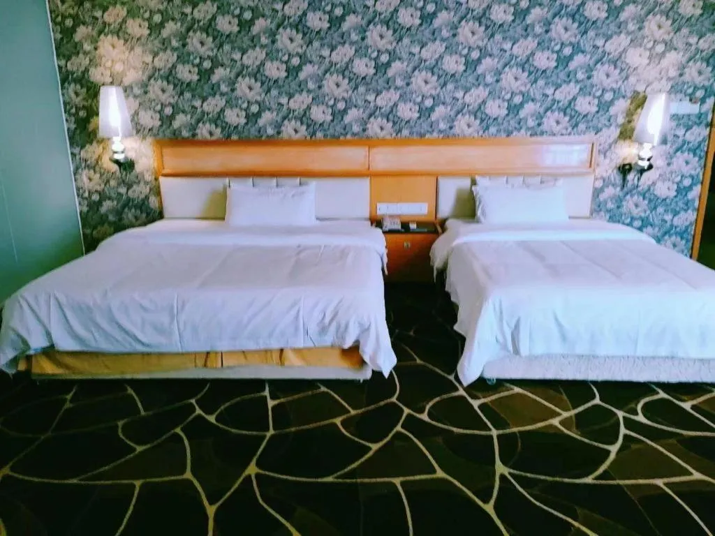 Bed in Foshan Nanhai Huifeng Holiday Hotel