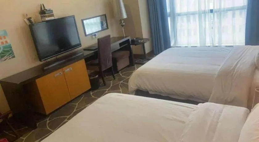 Bed in Foshan Nanhai Huifeng Holiday Hotel