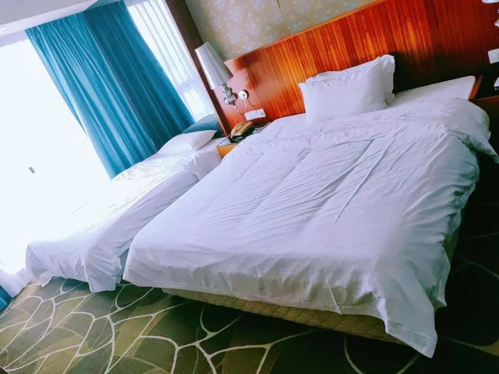 Bed in Foshan Nanhai Huifeng Holiday Hotel