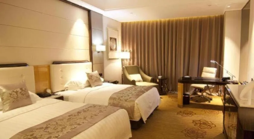Bed in Jin Jiang Mingcheng Hotel