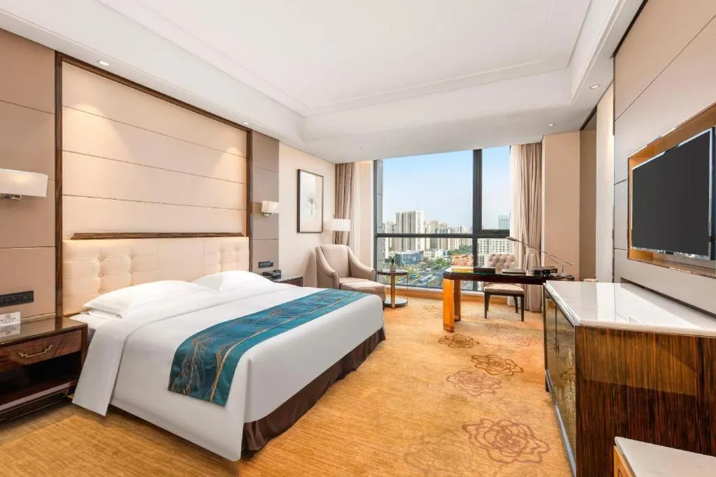 Bed in Jin Jiang Mingcheng Hotel