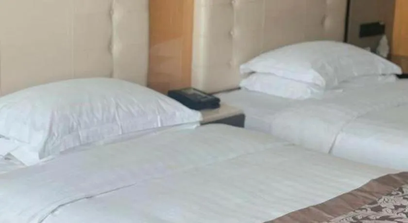 Bed in Jin Jiang Mingcheng Hotel