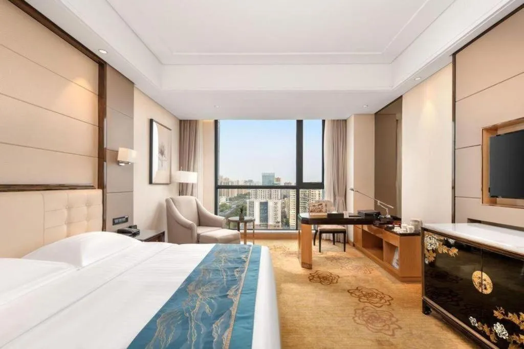 Bed in Jin Jiang Mingcheng Hotel