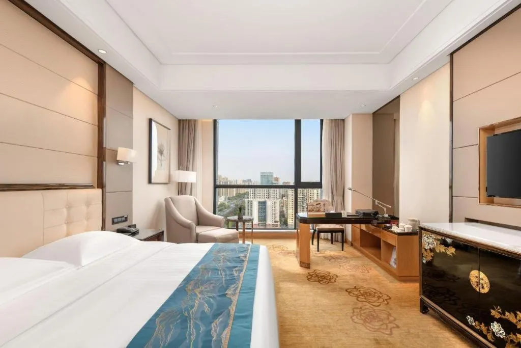 Bed in Jin Jiang Mingcheng Hotel