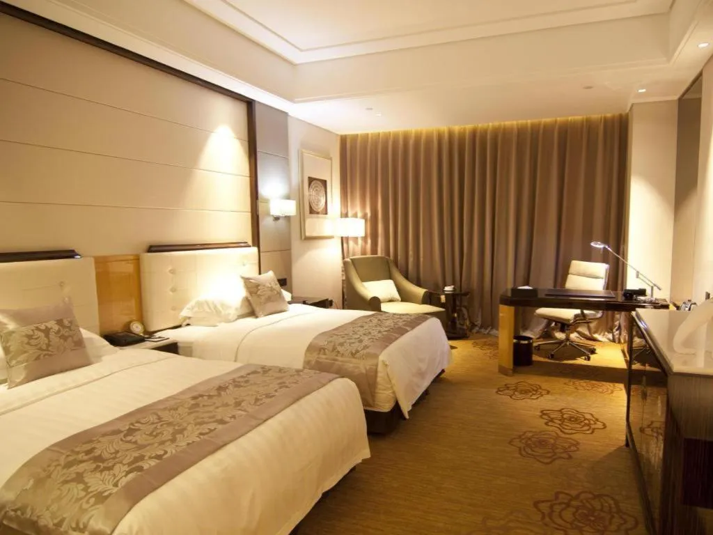 Bed in Jin Jiang Mingcheng Hotel