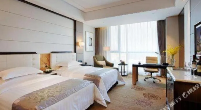 Bed in Jin Jiang Mingcheng Hotel
