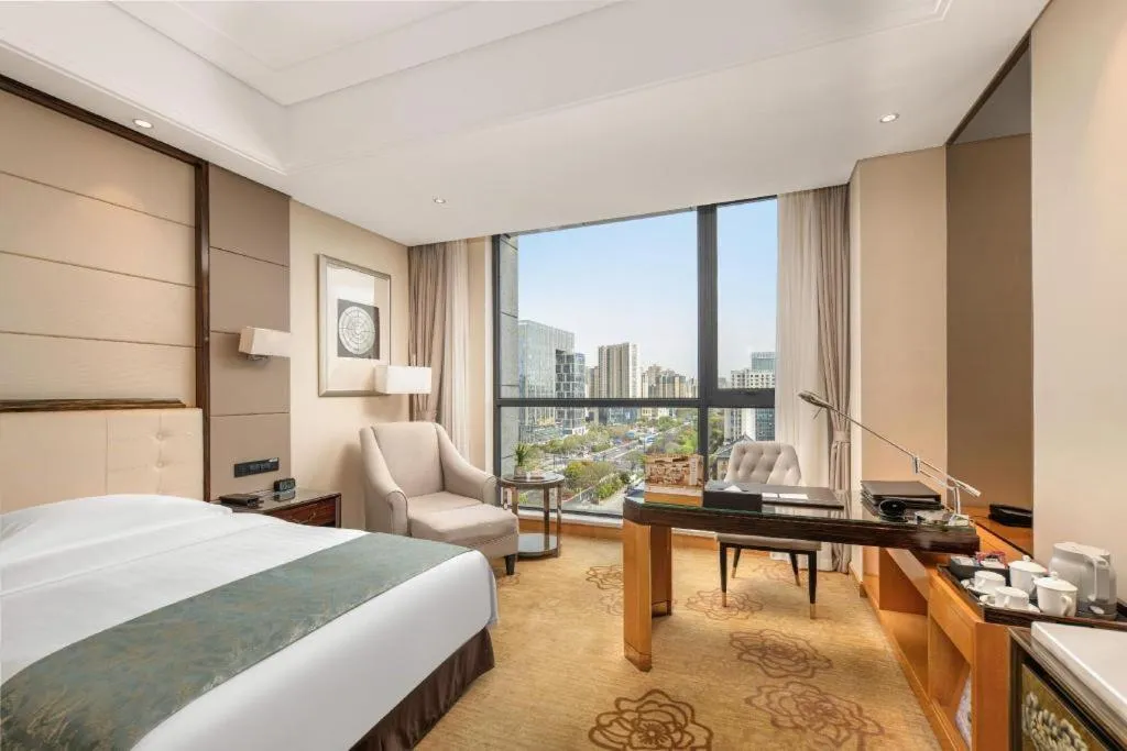 Bed in Jin Jiang Mingcheng Hotel