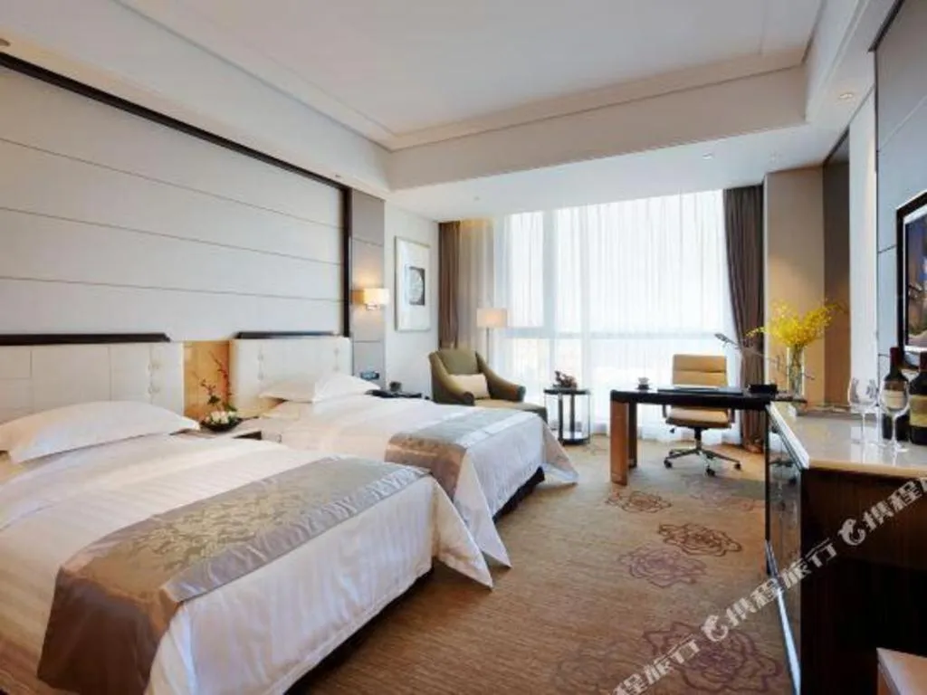 Bed in Jin Jiang Mingcheng Hotel