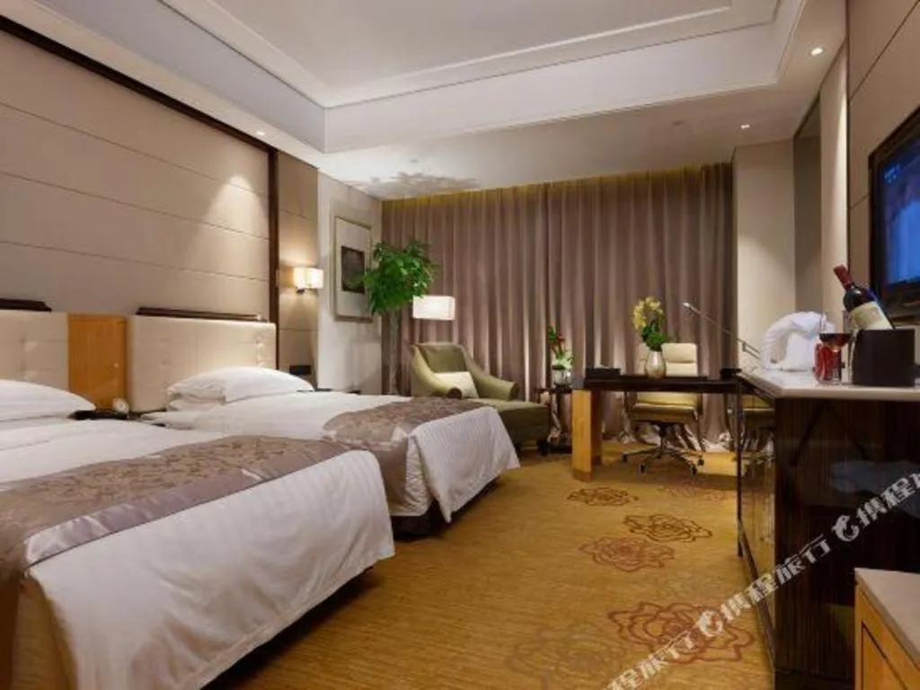 Bed in Jin Jiang Mingcheng Hotel