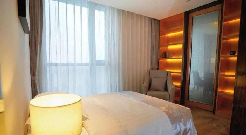 Bed in Jin Jiang Mingcheng Hotel