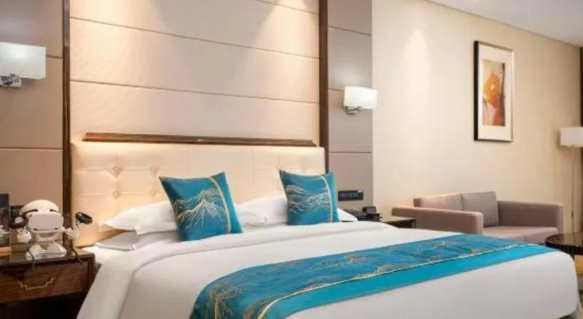 Bed in Jin Jiang Mingcheng Hotel