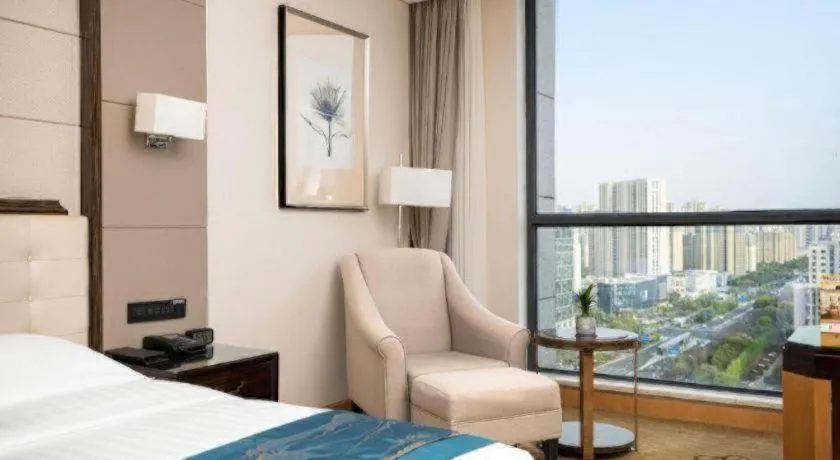 Bed in Jin Jiang Mingcheng Hotel