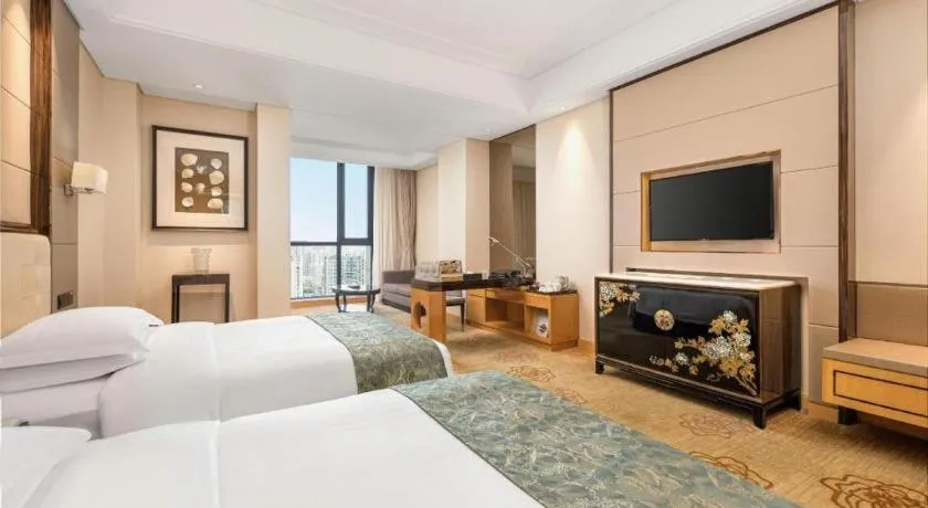 Bed in Jin Jiang Mingcheng Hotel