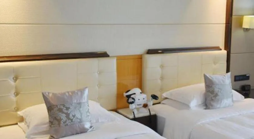 Bed in Jin Jiang Mingcheng Hotel