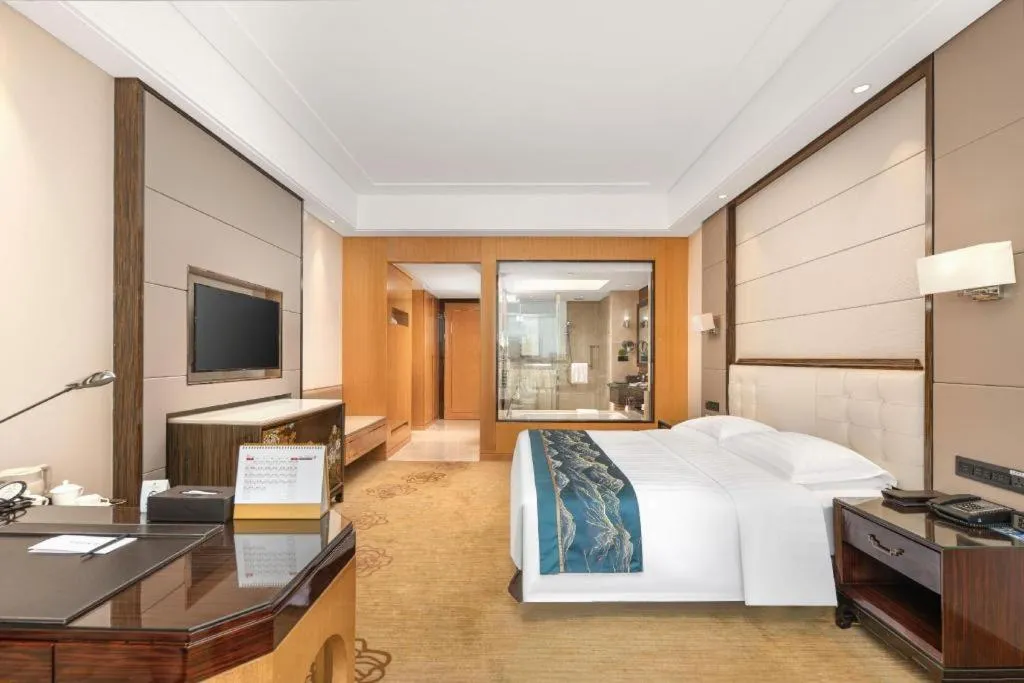 Bed in Jin Jiang Mingcheng Hotel