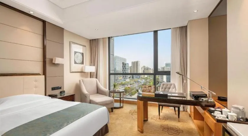 Bed in Jin Jiang Mingcheng Hotel