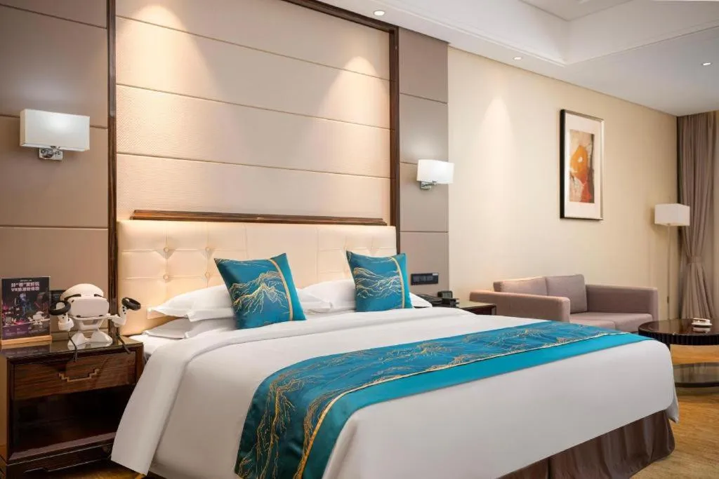 Bed in Jin Jiang Mingcheng Hotel