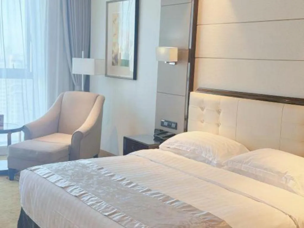 Bed in Jin Jiang Mingcheng Hotel