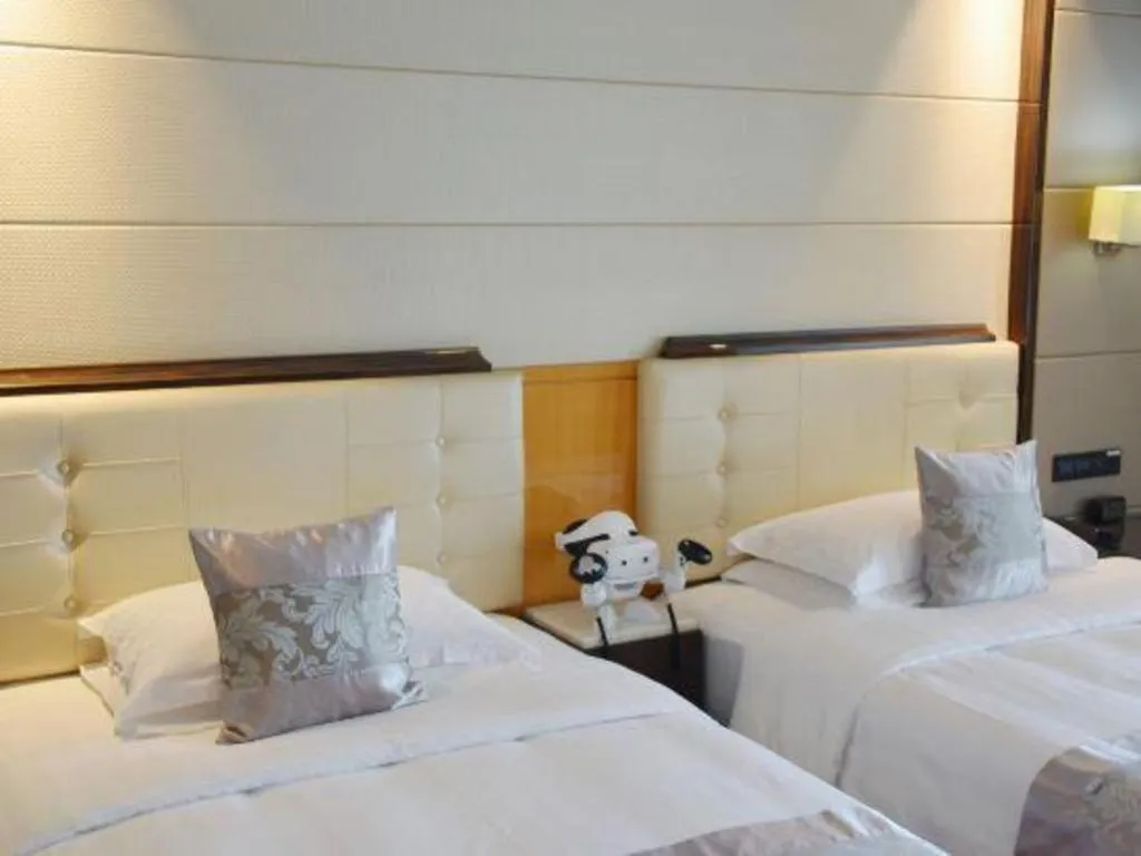 Bed in Jin Jiang Mingcheng Hotel