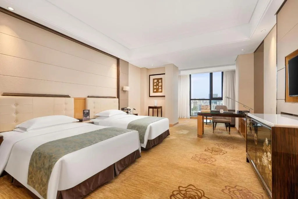 Bed in Jin Jiang Mingcheng Hotel