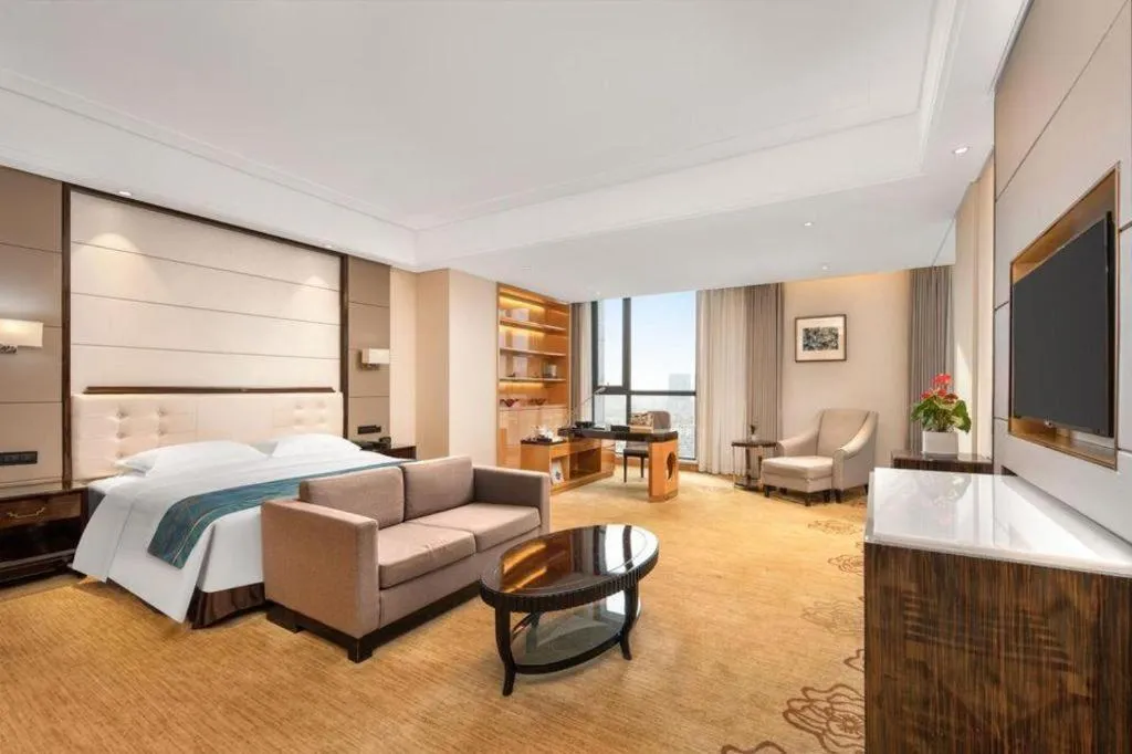 Bed in Jin Jiang Mingcheng Hotel