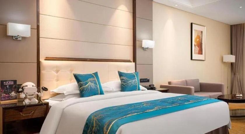 Bed in Jin Jiang Mingcheng Hotel