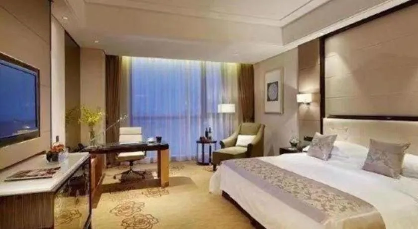 Bed in Jin Jiang Mingcheng Hotel
