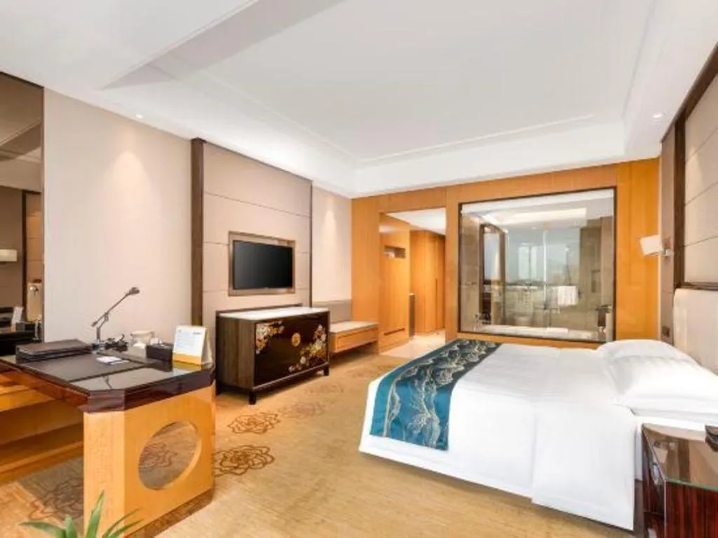 Bed in Jin Jiang Mingcheng Hotel