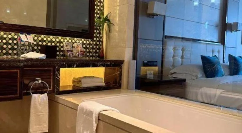 Bed in Jin Jiang Mingcheng Hotel