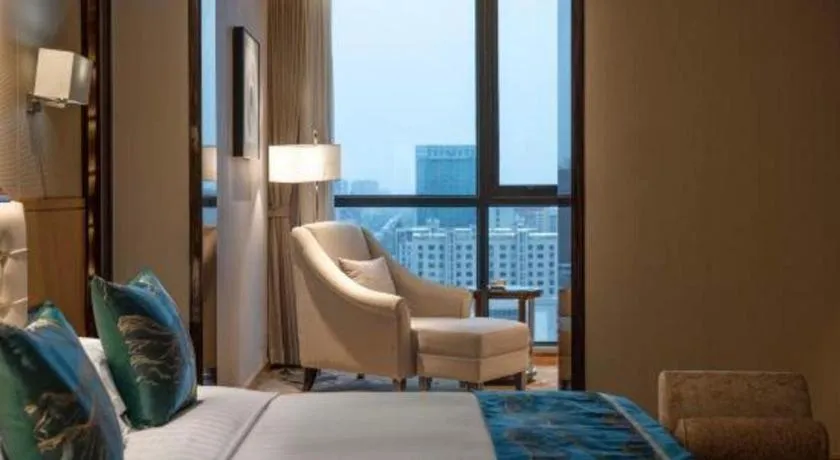 Bed in Jin Jiang Mingcheng Hotel