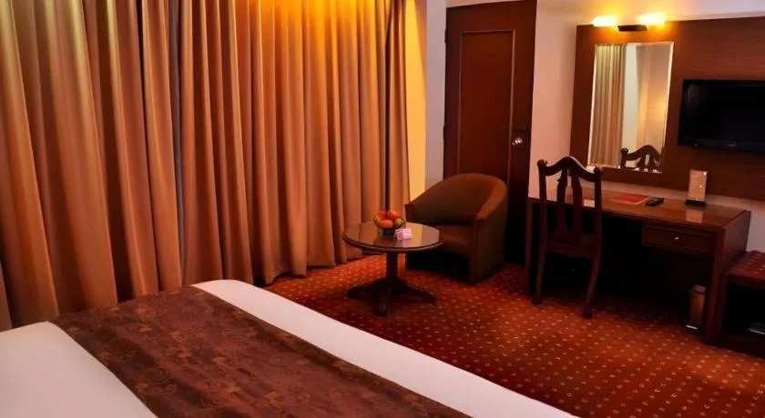 Bed in Kartika Chandra Hotel