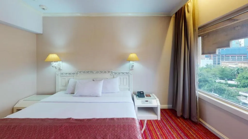 Bed in Kartika Chandra Hotel