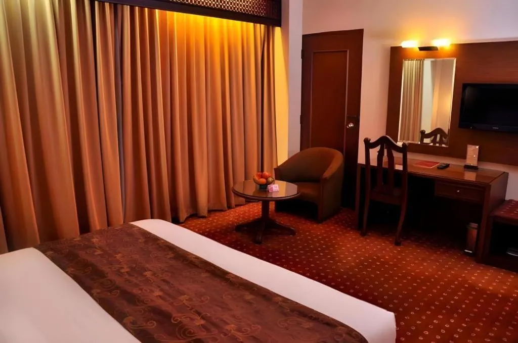 Bed in Kartika Chandra Hotel