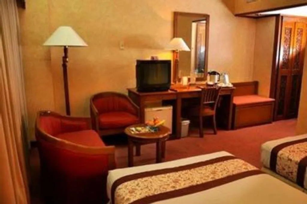 Bed in Kartika Chandra Hotel